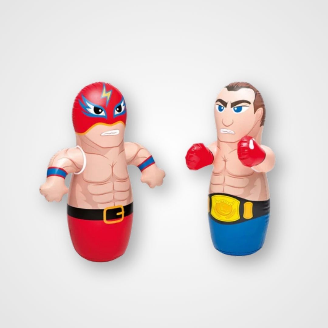 Two inflatable punching bags with cartoonish characters; one in red superhero attire and the other in a blue boxer outfit. Inflatable impact bag standing upright with rounded base – soft, child-safe tool designed for movement, focus, and emotional release.