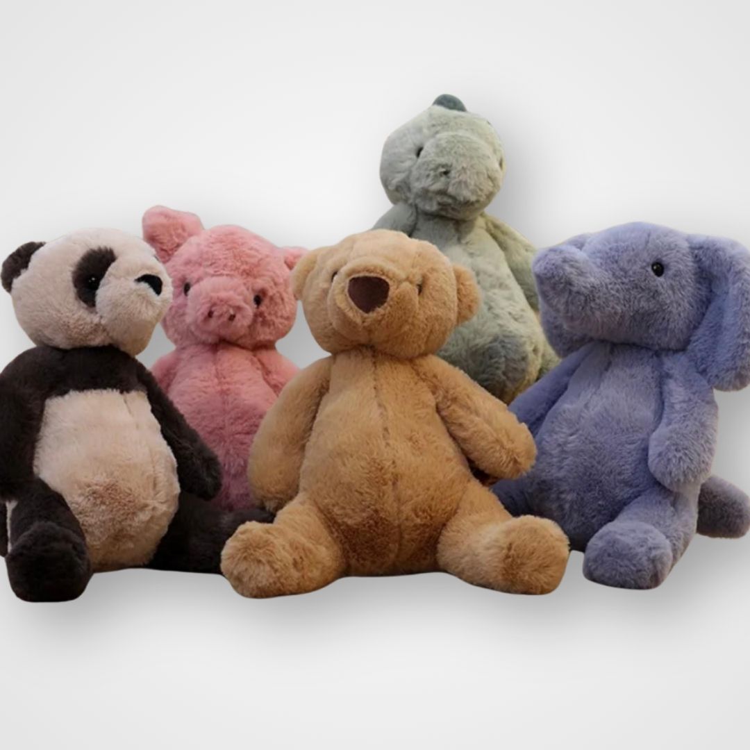 A collection of soft, plush toys in various colors including blue, brown, pink, and black, arranged in a row. Weighted therapy aid 1.2kg in soft fabric cover – calming tool providing deep pressure to support focus, relaxation, and daily routines.